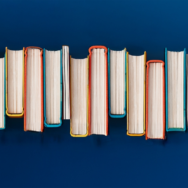 A row of books on a blue background