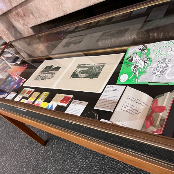 Display case with colorful artists’ books 