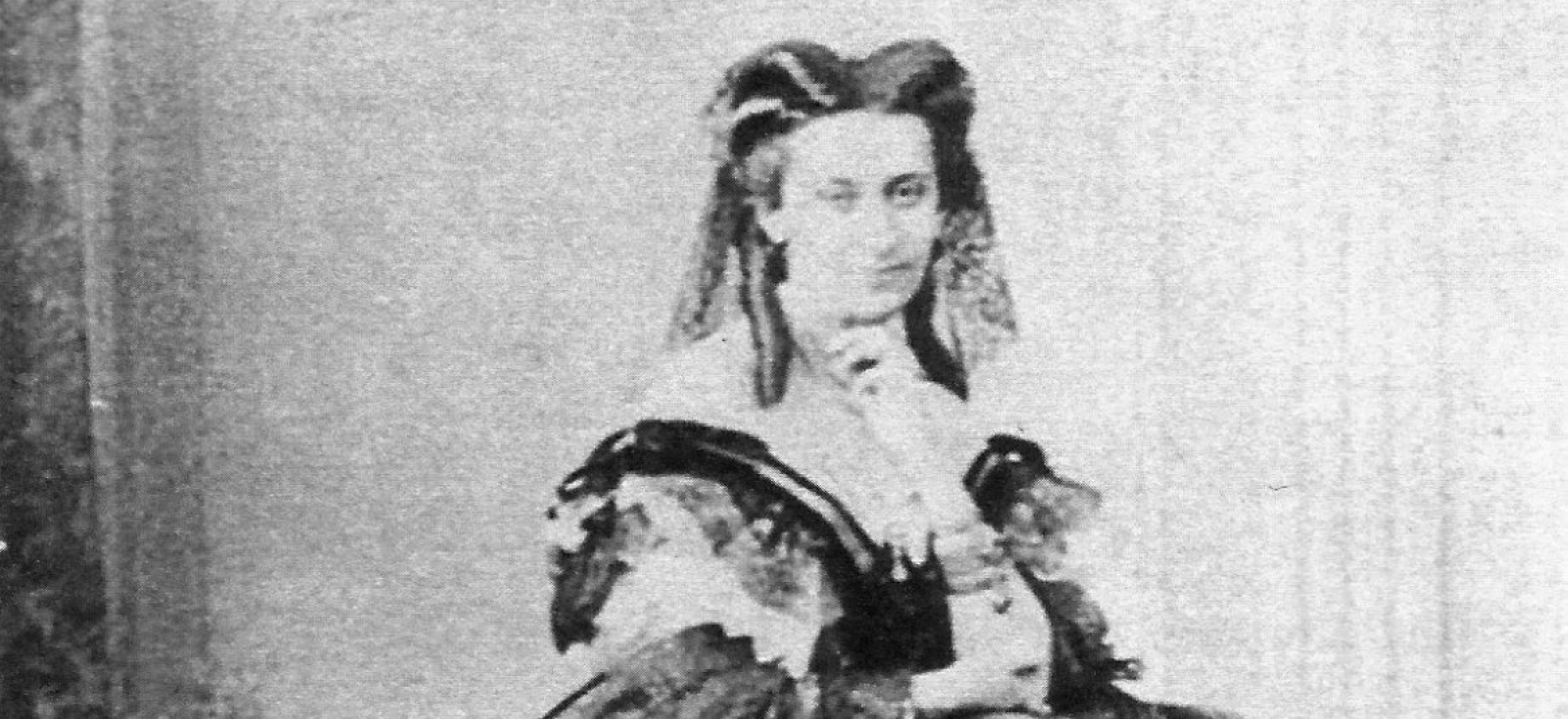 Aleksandra Pavlovna Sumarokova stands in a large dress 