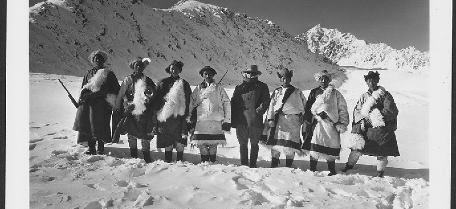 a group of individuals stands side-by-side