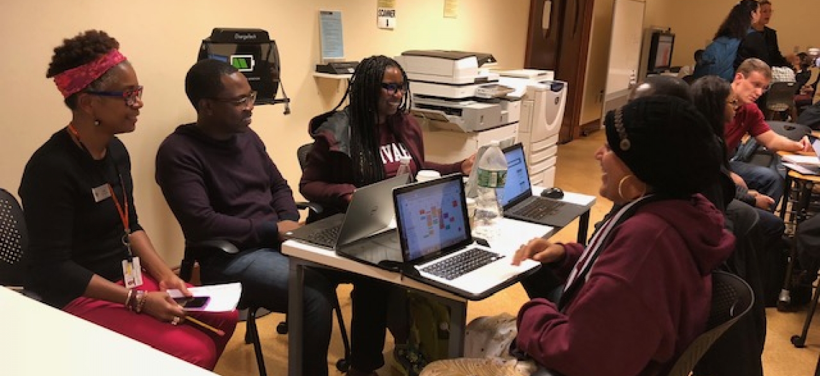 Students work with librarians at Baker 