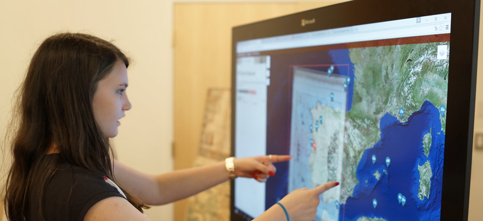 A student explores data visualization on a screen at Lamont