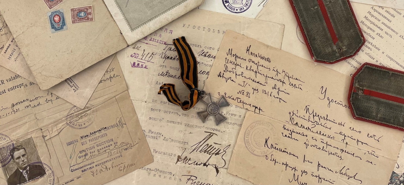 collage of letters, passports, notes, St. George's Cross medal and epaulets
