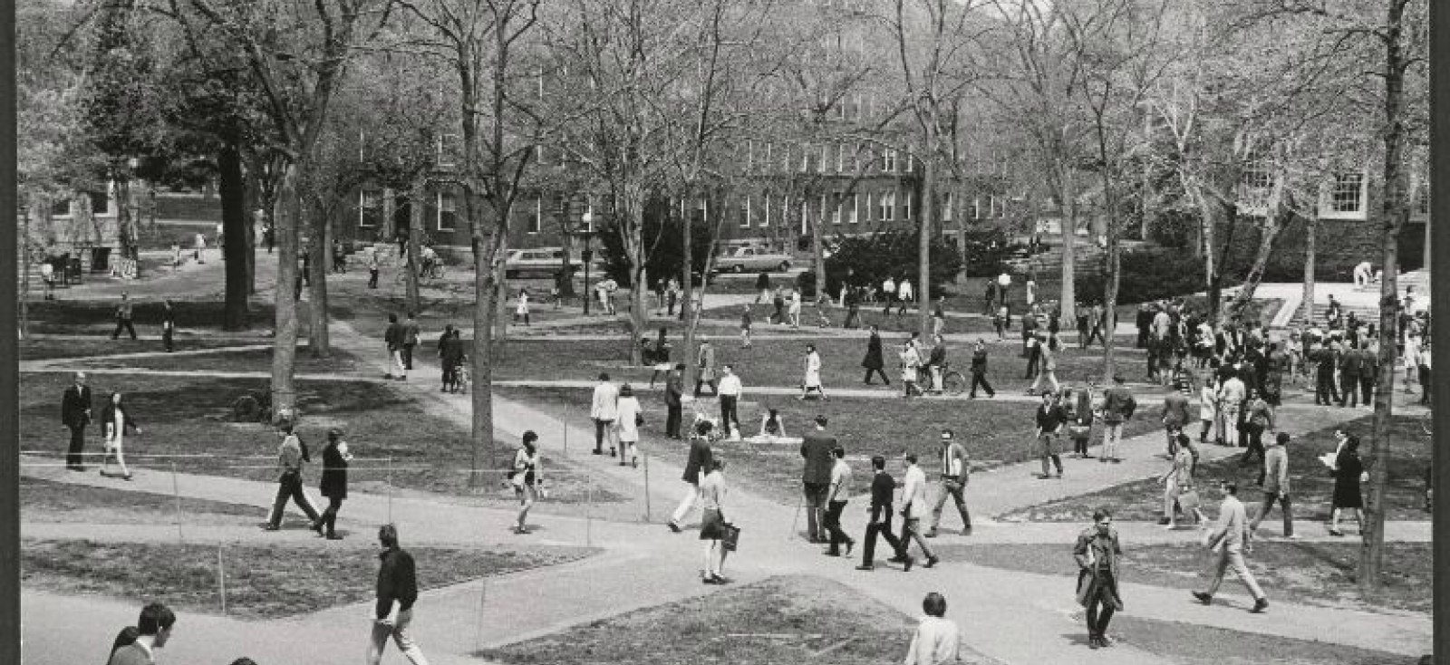 People walk through a crowded Harvard Yard in the 1960s.