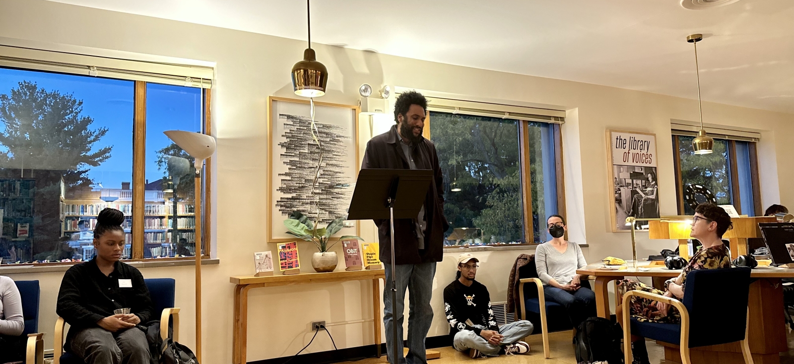 Tongo Eisen-Martin, Poet Laureate of San Francisco, speaks at a microphone