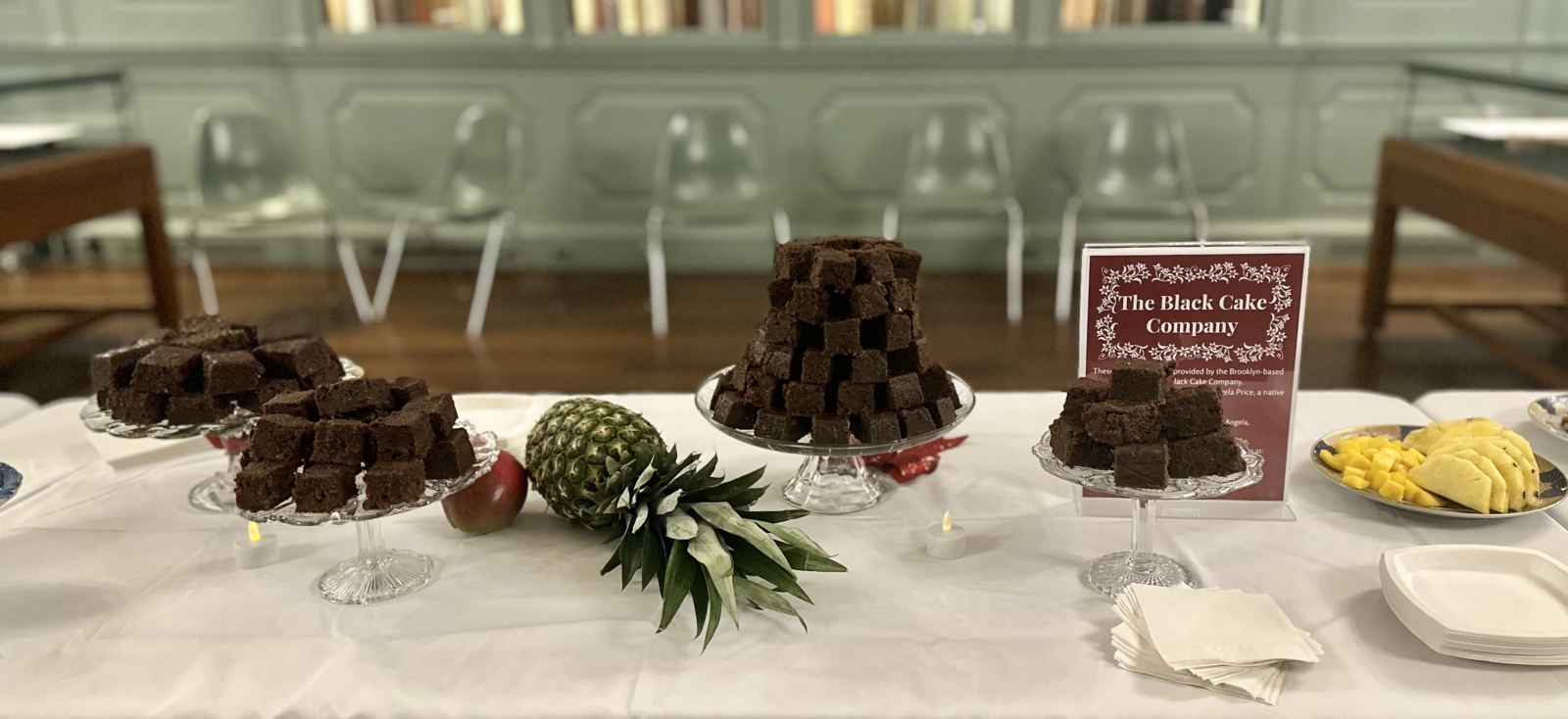 Black cake on a table at Houghton Library