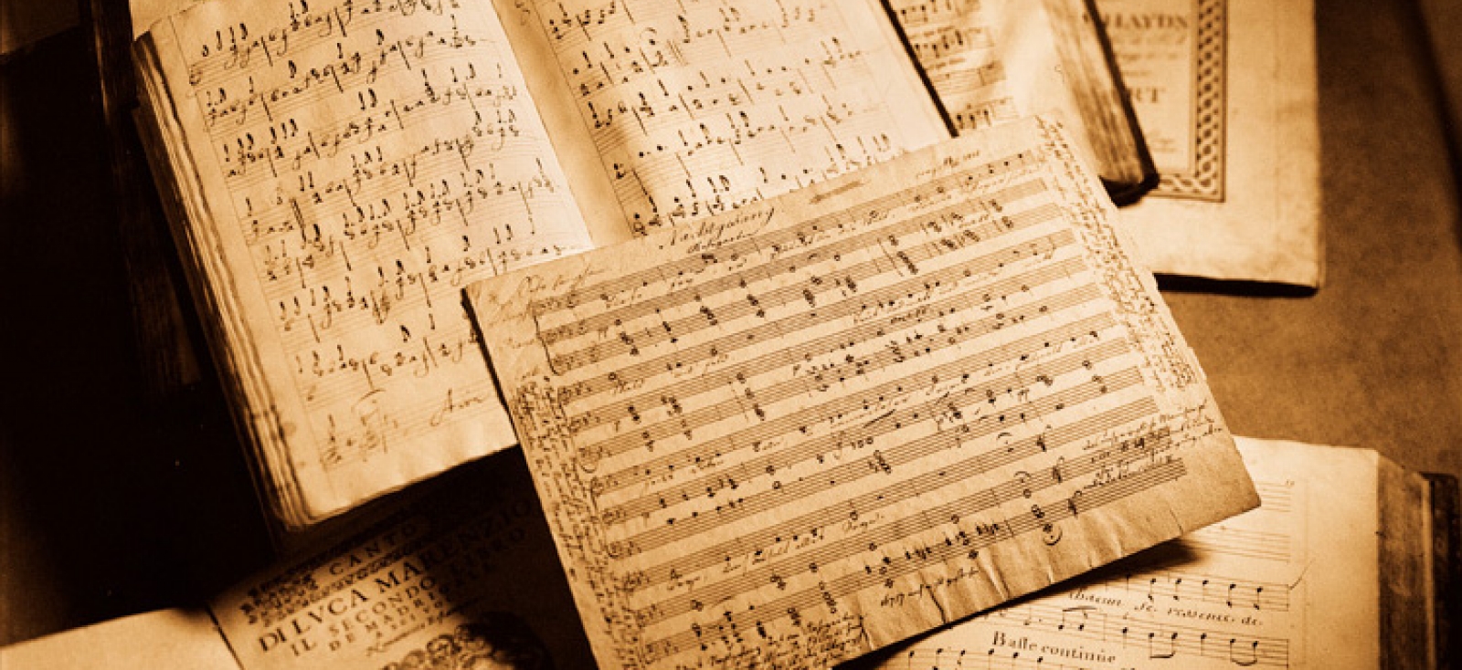 Musical scores arranged on a table.