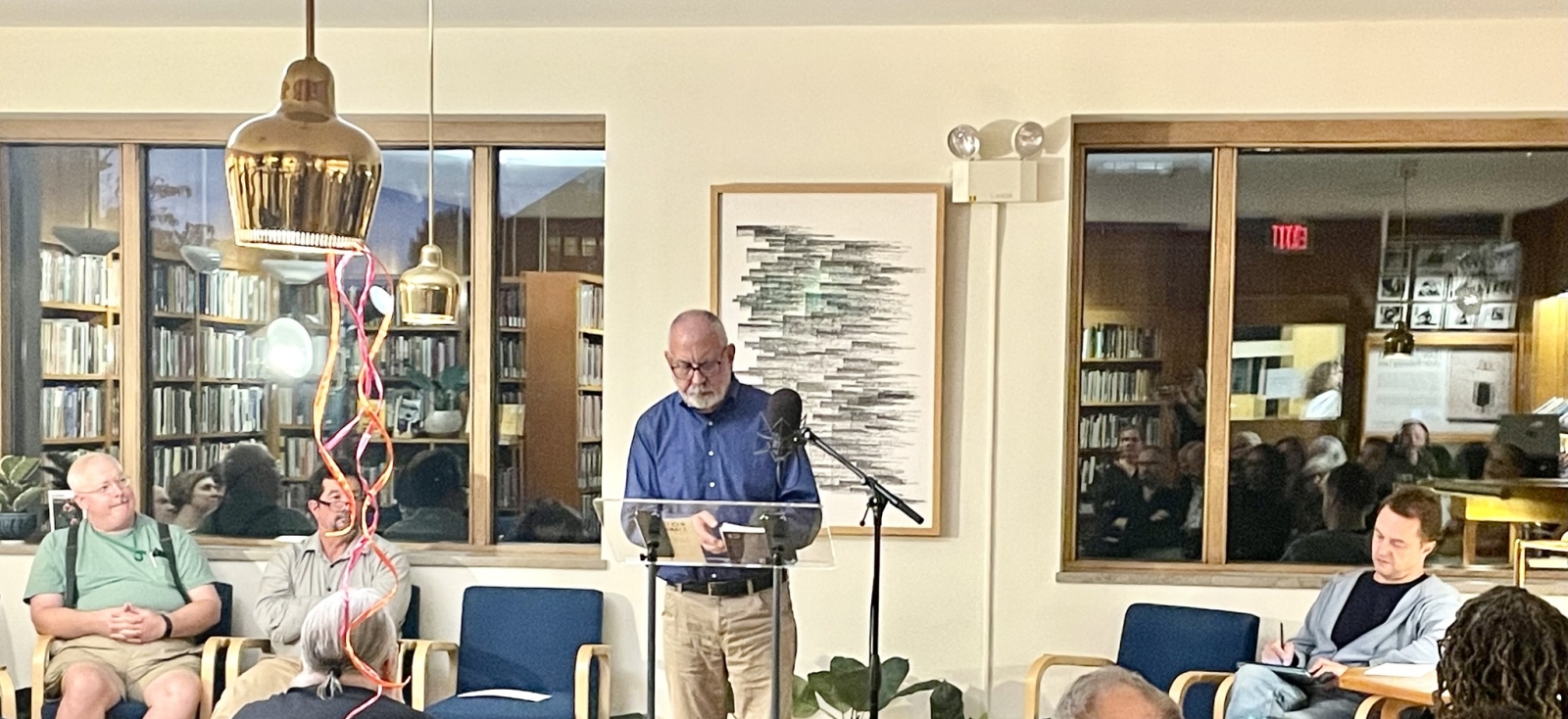 A poet reads at the woodberry poetry room