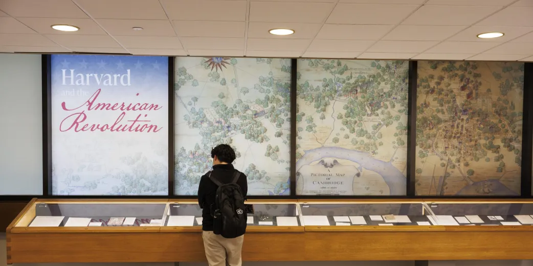 A visitor checks out the Harvard and the American Revolution Exhibit 