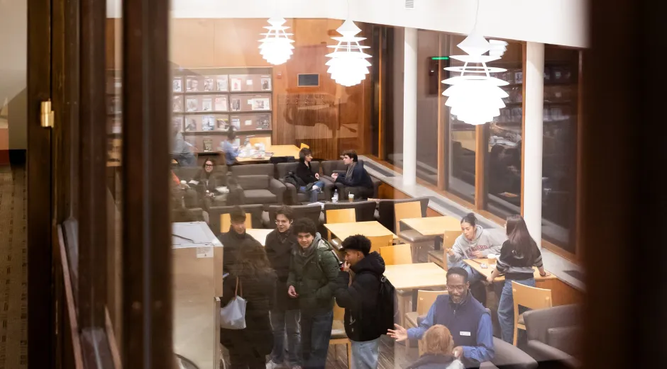 A view of the Lamont Cafe from above, with people gathered and talking