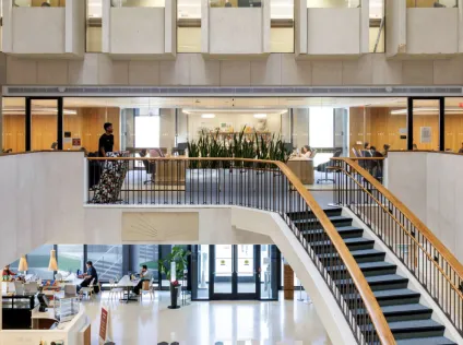 Countway Library interior, with a spiral staircase at the center.