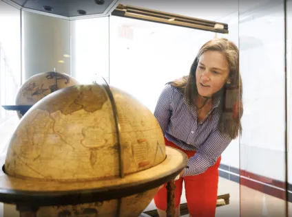 Molly Taylor-Poleskey rotating Harvard's Mercator Globes