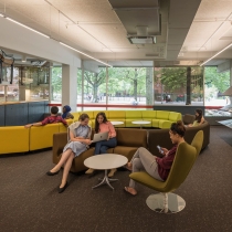 Students lounge on the main level of the Cabot Science Library. 