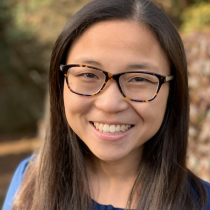 Profile picture of Charlotte Cotter in blue shirt against natural background