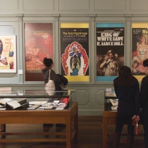 visitors look at a poster
