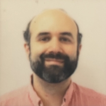 headshot of Josh from when his beard was less grey