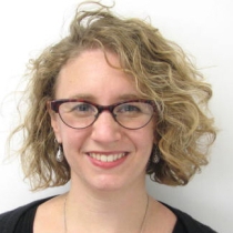 Image of white woman with short blonde hair and eyeglasses