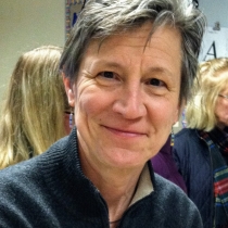 portrait of June wearing a dark sweater