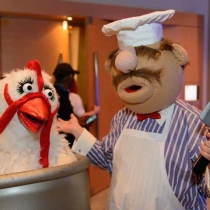 Grace and friend dressed in muppet costumes as the Swedish Chef and Camilla the Chicken.